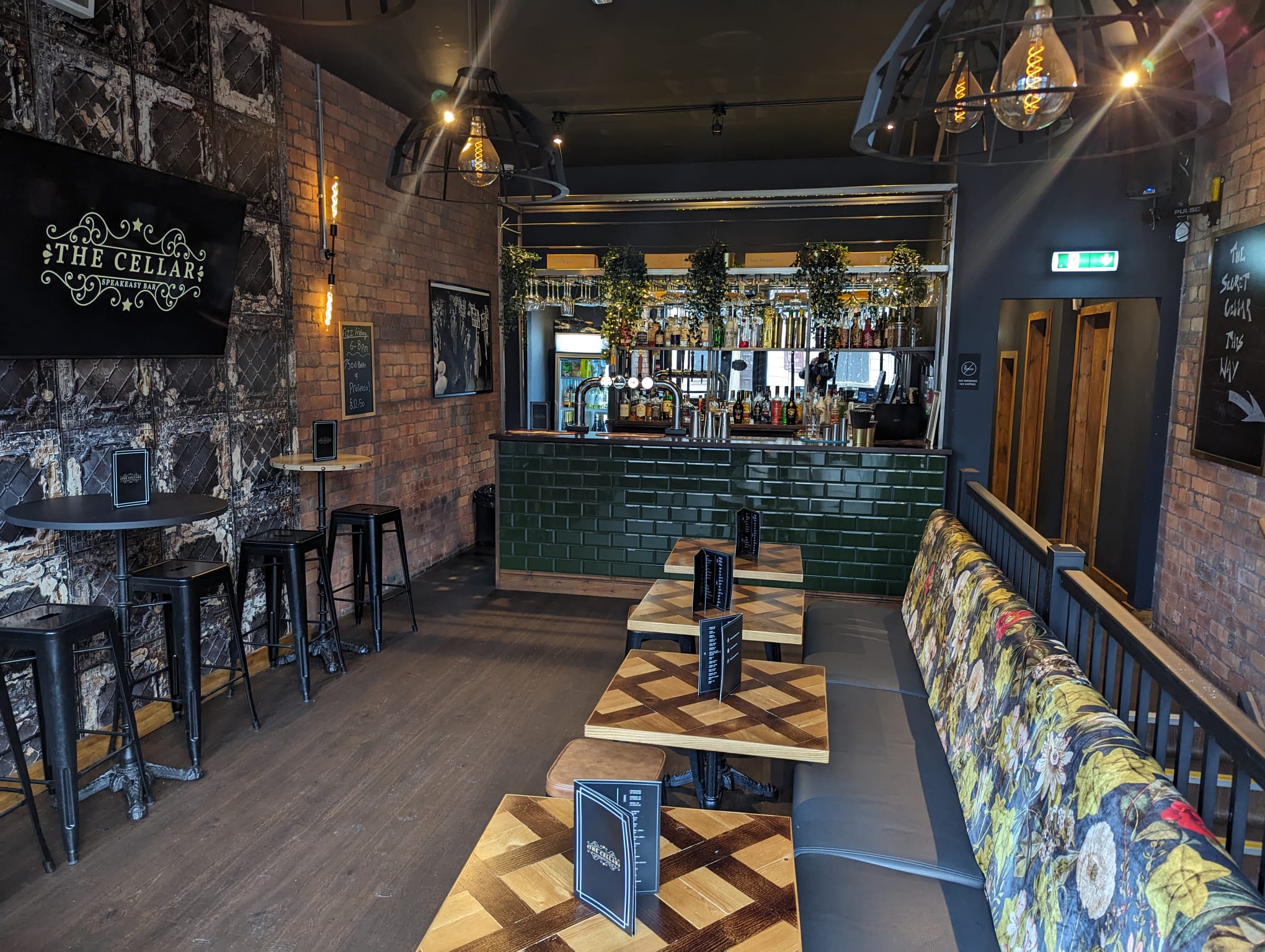 The Cellar Speakeasy Bar — main bar room with signature green tiled bar, Ashton in Makerfield