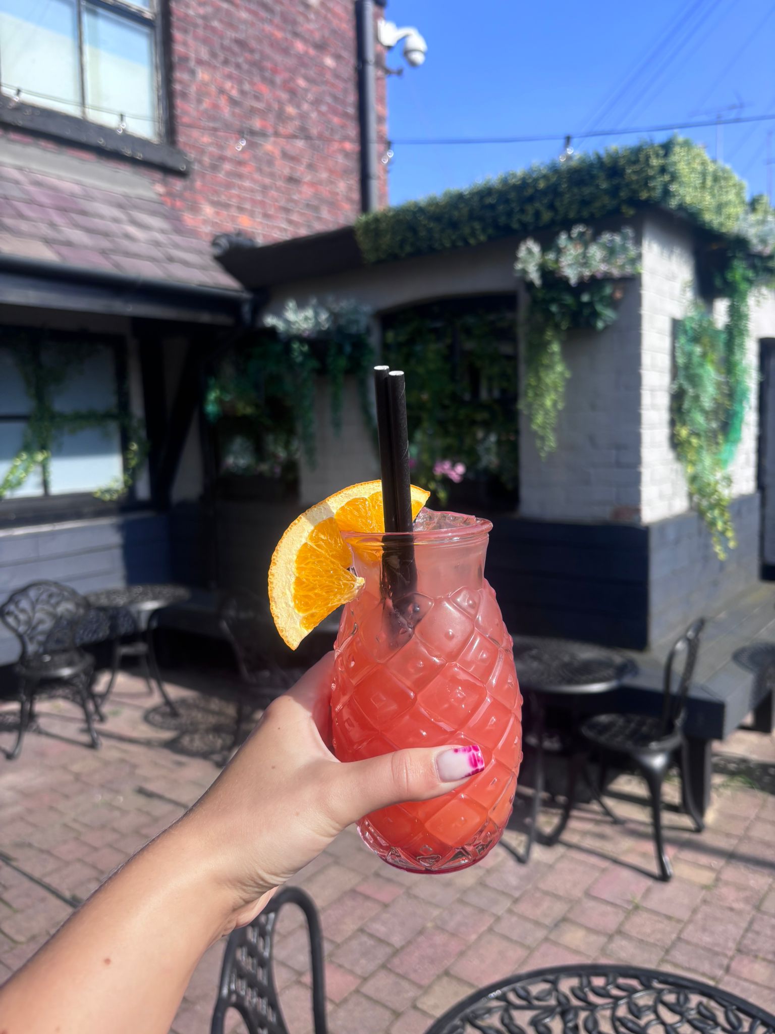 Cocktails on the garden terrace at Verona Kitchen & Bar